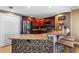 Kitchen with granite countertops and dark wood cabinets at 3799 S Atlantic Ave # 602, Daytona Beach, FL 32118