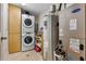 Well-lit laundry room with washer, dryer, and extra storage at 3799 S Atlantic Ave # 602, Daytona Beach, FL 32118
