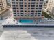 Beachfront community pool and patio area with ample seating at 3799 S Atlantic Ave # 602, Daytona Beach, FL 32118