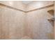 Large tiled shower with built-in shelving at 3799 S Atlantic Ave # 602, Daytona Beach, FL 32118