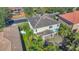 Two-story house, tile roof, pool, lush landscaping at 3915 Shoreview Dr, Kissimmee, FL 34744