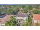 Two-story house, tile roof, pool, lush landscaping at 3915 Shoreview Dr, Kissimmee, FL 34744