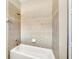 Bathroom with shower/tub combo and tile surround at 3915 Shoreview Dr, Kissimmee, FL 34744