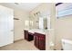 Double vanity bathroom with tile floors and a toilet at 3915 Shoreview Dr, Kissimmee, FL 34744