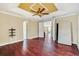 Large bedroom with hardwood floors and access to a loft area at 3915 Shoreview Dr, Kissimmee, FL 34744