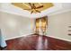 Bright bedroom with hardwood floors and a ceiling fan at 3915 Shoreview Dr, Kissimmee, FL 34744