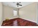 Bedroom with hardwood floors and a window at 3915 Shoreview Dr, Kissimmee, FL 34744