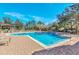 Relaxing community pool area with lounge chairs and pergola at 3915 Shoreview Dr, Kissimmee, FL 34744