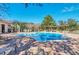 Inviting community pool with lounge chairs and a pergola at 3915 Shoreview Dr, Kissimmee, FL 34744