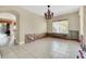 Spacious dining room with chandelier and water damage at 3915 Shoreview Dr, Kissimmee, FL 34744