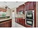 Kitchen with double oven and granite countertops at 3915 Shoreview Dr, Kissimmee, FL 34744