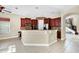Kitchen boasts granite countertops and dark wood cabinets at 3915 Shoreview Dr, Kissimmee, FL 34744
