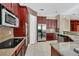 Spacious kitchen with dark wood cabinets and granite countertops at 3915 Shoreview Dr, Kissimmee, FL 34744