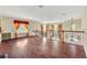 Open living room with hardwood floors and a view of the second floor at 3915 Shoreview Dr, Kissimmee, FL 34744