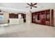 Open living area with tile floors and built-in shelving at 3915 Shoreview Dr, Kissimmee, FL 34744