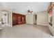 Spacious living room featuring built-in shelving and tile floors at 3915 Shoreview Dr, Kissimmee, FL 34744