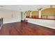 Spacious loft area with hardwood floors and built-in shelving at 3915 Shoreview Dr, Kissimmee, FL 34744