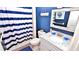 Bathroom with blue and white nautical decor at 4153 S Atlantic Ave # 1020, New Smyrna Beach, FL 32169