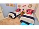 Guest bedroom with twin beds and nautical theme at 4153 S Atlantic Ave # 1020, New Smyrna Beach, FL 32169