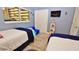Guest bedroom with twin beds and ocean view at 4153 S Atlantic Ave # 1020, New Smyrna Beach, FL 32169
