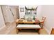 Bright dining area with rustic wood table and bench seating at 4153 S Atlantic Ave # 1020, New Smyrna Beach, FL 32169