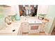 White kitchen with modern appliances and ocean view at 4153 S Atlantic Ave # 1020, New Smyrna Beach, FL 32169