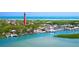 Aerial view of waterfront homes and a lighthouse near the ocean at 4153 S Atlantic Ave # 1030, New Smyrna Beach, FL 32169