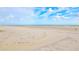 Relaxing beach with white sand and blue ocean at 4153 S Atlantic Ave # 1030, New Smyrna Beach, FL 32169