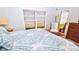Bedroom with king bed, wicker chair, and direct ocean views at 4153 S Atlantic Ave # 1030, New Smyrna Beach, FL 32169