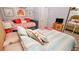 Bedroom with a double bed and a daybed, offering ample sleeping space for guests at 4153 S Atlantic Ave # 1030, New Smyrna Beach, FL 32169