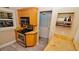 Kitchen with light wood cabinets, granite countertops and stainless steel appliances at 4153 S Atlantic Ave # 1030, New Smyrna Beach, FL 32169