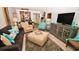 Open living room with ocean views and comfy furniture at 4153 S Atlantic Ave # 1030, New Smyrna Beach, FL 32169