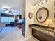 Convenient bathroom with granite countertop and an open view to an office space at 4208 Clubside Dr # 4208, Longwood, FL 32779