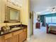 Modern bathroom with granite countertop and a large mirror at 4208 Clubside Dr # 4208, Longwood, FL 32779