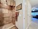 Walk-in shower with grab bars and tiled walls at 4208 Clubside Dr # 4208, Longwood, FL 32779