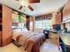Comfortable bedroom with built-in murphy bed and home office area at 4208 Clubside Dr # 4208, Longwood, FL 32779