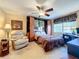 This bedroom contains a built-in Murphy bed and a comfortable workstation with natural light at 4208 Clubside Dr # 4208, Longwood, FL 32779