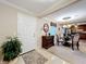 Bright dining area with glass table and kitchen view at 4208 Clubside Dr # 4208, Longwood, FL 32779