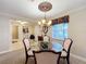 Dining room with a glass-top table and neutral decor at 4208 Clubside Dr # 4208, Longwood, FL 32779