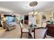 Bright dining room features a glass-top table and comfortable seating for four at 4208 Clubside Dr # 4208, Longwood, FL 32779