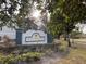 Community entrance sign with landscaping and paved road at 4208 Clubside Dr # 4208, Longwood, FL 32779