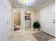 Condo entry with tile floor, washer, dryer, and toilet at 4208 Clubside Dr # 4208, Longwood, FL 32779