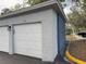 Private garage with white door and exterior lighting at 4208 Clubside Dr # 4208, Longwood, FL 32779