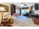 Efficient home office with built-in desk and shelving, plus a comfy recliner at 4208 Clubside Dr # 4208, Longwood, FL 32779