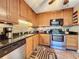 Modern kitchen with stainless steel appliances and granite countertops at 4208 Clubside Dr # 4208, Longwood, FL 32779