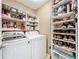 Well-organized laundry room with ample storage shelves and modern washer and dryer at 4208 Clubside Dr # 4208, Longwood, FL 32779