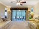 Bright living room with recessed lighting, beige carpet, and access to a screened patio at 4208 Clubside Dr # 4208, Longwood, FL 32779