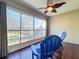 Bright screened porch with blue chairs and view of backyard at 4208 Clubside Dr # 4208, Longwood, FL 32779