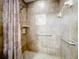 Walk-in shower with tiled walls and grab bars at 4208 Clubside Dr # 4208, Longwood, FL 32779