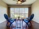 Relaxing sunroom with two chairs and a small table at 4208 Clubside Dr # 4208, Longwood, FL 32779
